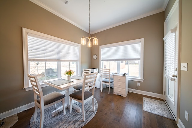 dining space with a healthy amount of sunlight, dark hardwood / wood-style floors, ornamental molding, and a notable chandelier