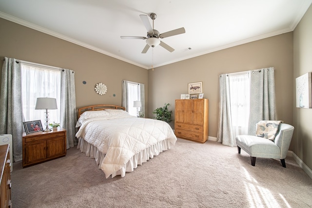 carpeted bedroom featuring ceiling fan, ornamental molding, and multiple windows