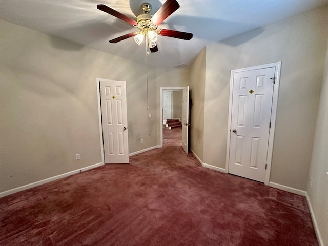 unfurnished bedroom featuring carpet and ceiling fan