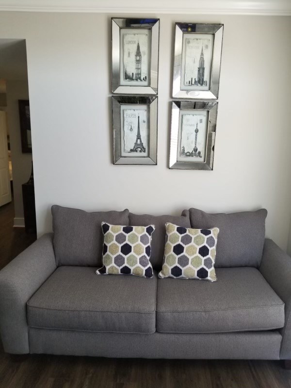 living room with crown molding and dark hardwood / wood-style floors