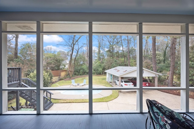 doorway to outside featuring wood-type flooring