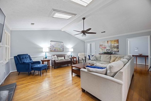 living area featuring crown molding, vaulted ceiling with beams, light wood-type flooring, and ceiling fan