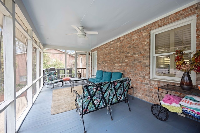 sunroom with a ceiling fan