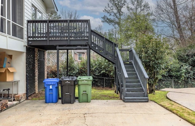 view of patio / terrace with stairs, fence, and a wooden deck