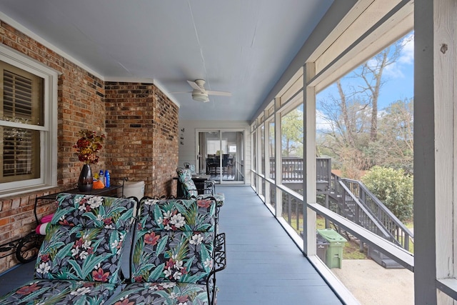 sunroom with a ceiling fan