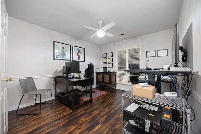 office with wood finished floors, a ceiling fan, visible vents, and baseboards