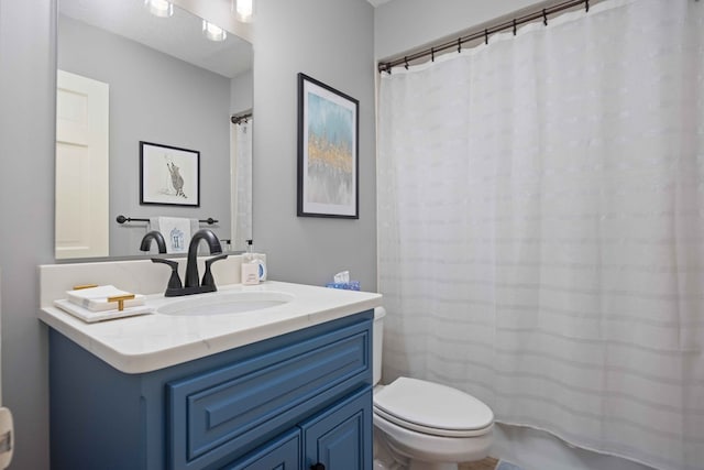 full bathroom with toilet, vanity, and a shower with curtain