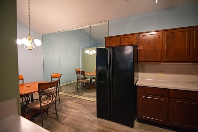 4200 Bridgecrest Dr Unit E4, Phenix City, AL 36867 - kitchen with black fridge with ice dispenser, a chandelier, light countertops, wood finished floors, and pendant lighting