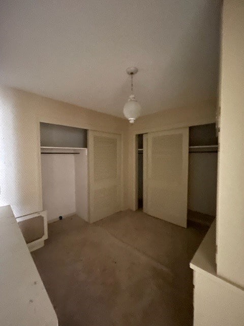 unfurnished bedroom featuring a closet