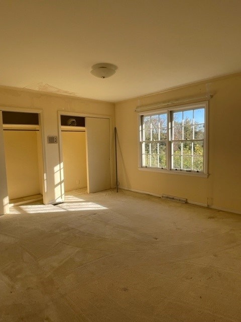 unfurnished bedroom with light carpet