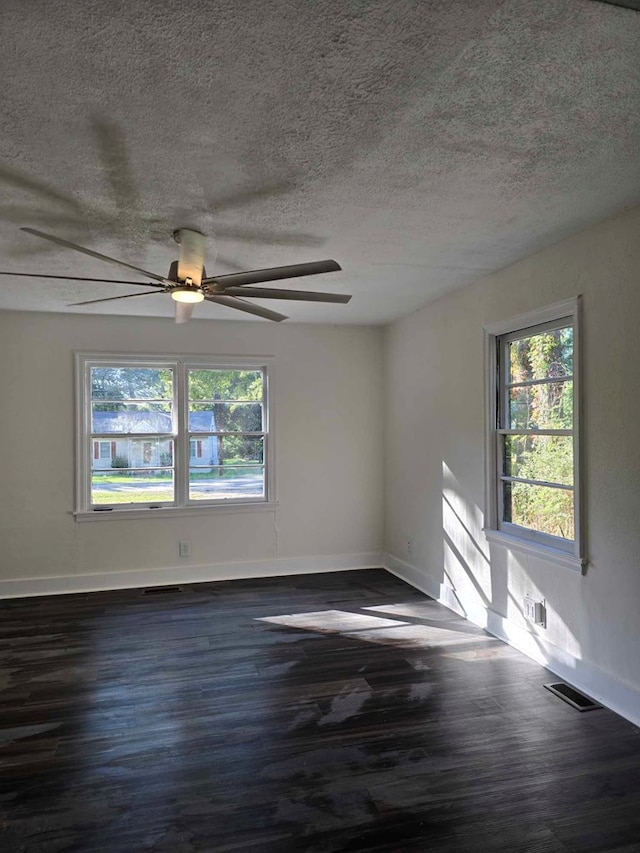 2514 Avalon Rd, Columbus, GA 31907 - spare room with dark wood finished floors, healthy amount of natural light, a ceiling fan, and a textured ceiling
