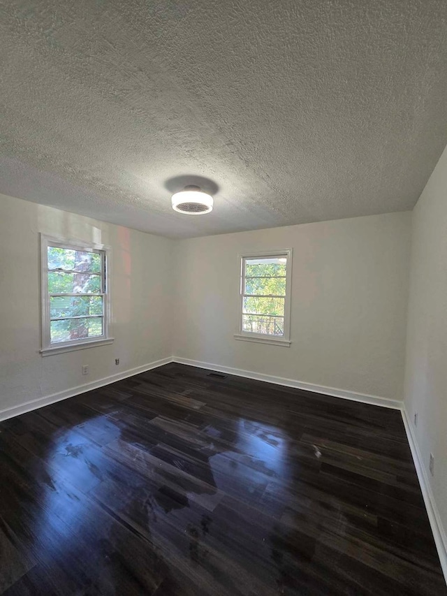 2514 Avalon Rd, Columbus, GA 31907 - unfurnished room featuring dark wood-type flooring and a textured ceiling