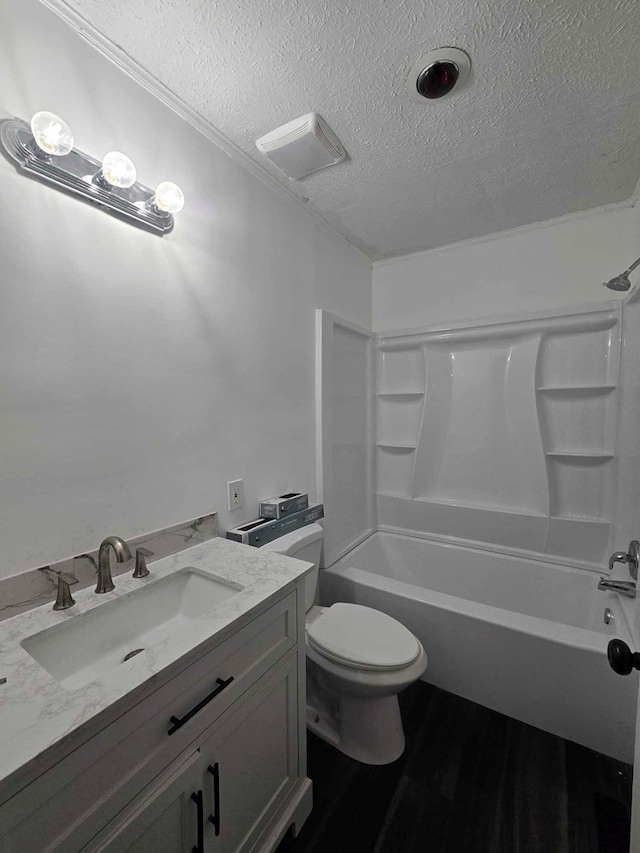 2514 Avalon Rd, Columbus, GA 31907 - bathroom with a textured ceiling, tub / shower combination, vanity, and wood finished floors
