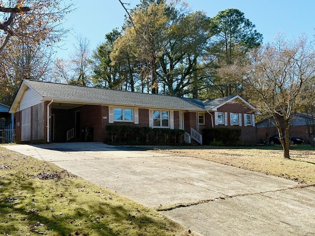 single story home featuring a carport