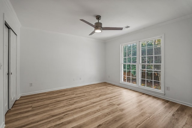 4975 Glacier Dr, Columbus, GA 31907 - unfurnished bedroom with crown molding, wood finished floors, baseboards, a closet, and a ceiling fan