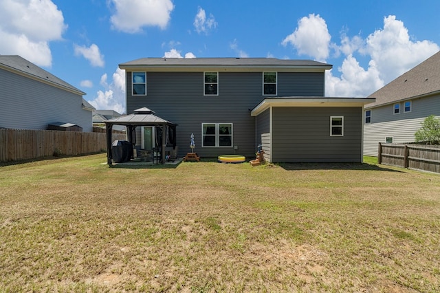 10 Red Maple St, Phenix City, AL 36869 - rear view of house with a gazebo, a fenced backyard, and a patio area