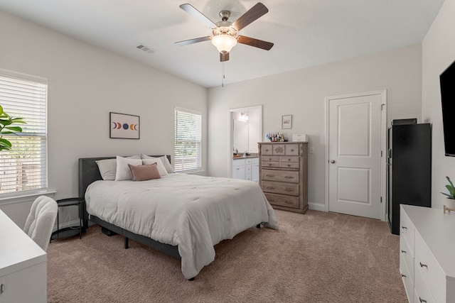 10 Red Maple St, Phenix City, AL 36869 - bedroom featuring light colored carpet, connected bathroom, and ceiling fan