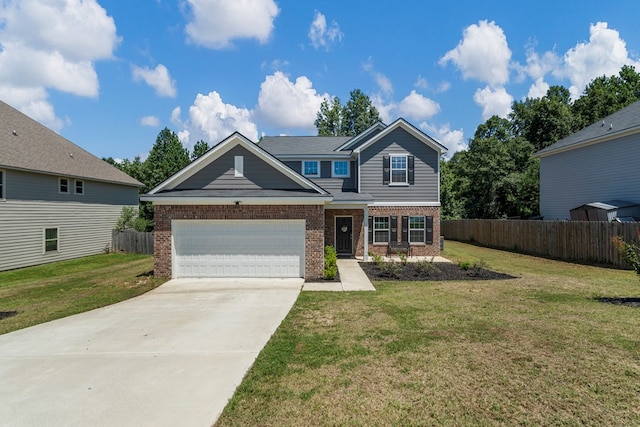 10 Red Maple St, Phenix City, AL 36869 - view of front of house featuring brick siding, driveway, and an attached garage