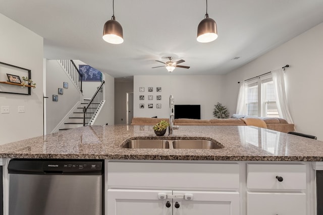 10 Red Maple St, Phenix City, AL 36869 - kitchen featuring stainless steel dishwasher, open floor plan, white cabinets, and a ceiling fan