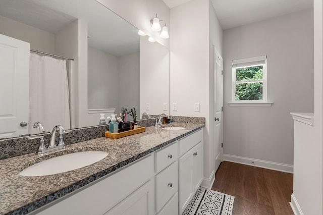 10 Red Maple St, Phenix City, AL 36869 - full bathroom with wood finished floors and double vanity