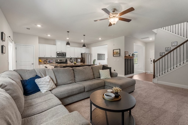10 Red Maple St, Phenix City, AL 36869 - carpeted living room featuring stairway, ceiling fan, and recessed lighting