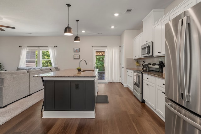10 Red Maple St, Phenix City, AL 36869 - kitchen with stainless steel appliances, open floor plan, plenty of natural light, white cabinetry, and recessed lighting