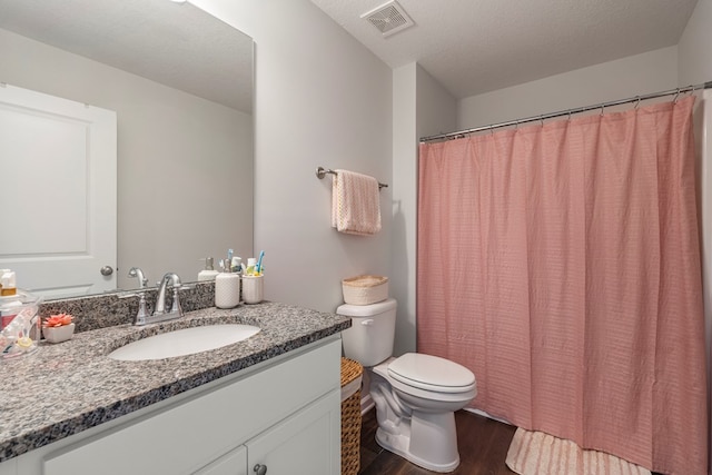 10 Red Maple St, Phenix City, AL 36869 - bathroom with wood finished floors, vanity, and a shower with curtain
