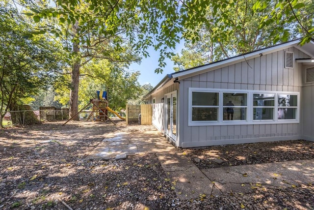 view of property exterior featuring a playground