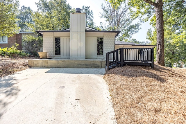 rear view of house featuring a deck