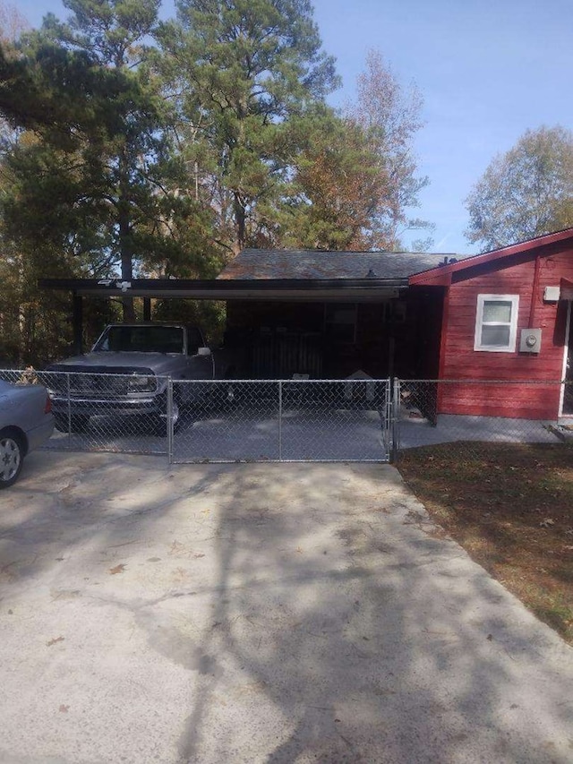 view of side of property with a carport