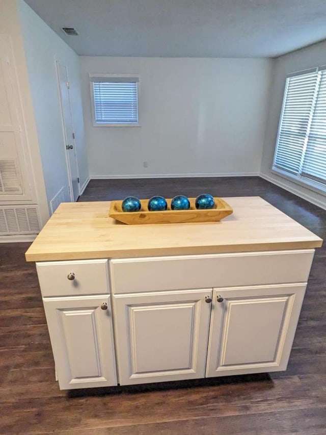 kitchen featuring white cabinetry, wooden counters, and dark hardwood / wood-style floors