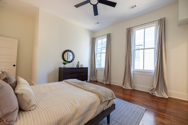 bedroom featuring dark hardwood / wood-style floors and ceiling fan