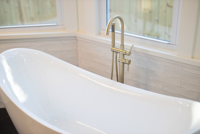 bathroom featuring a bathtub and sink