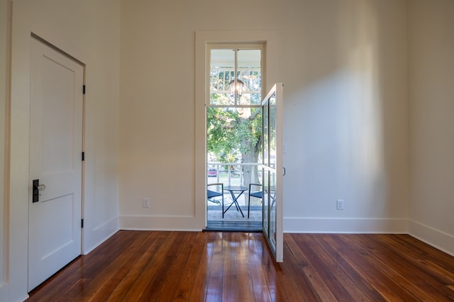 interior space with dark hardwood / wood-style flooring and a notable chandelier