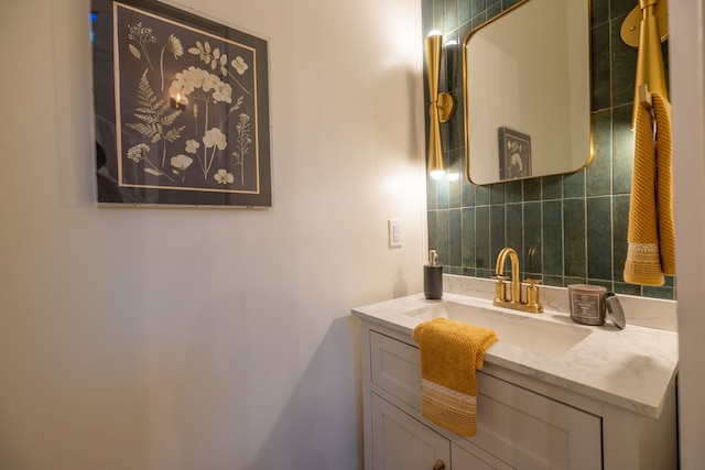 bathroom featuring tasteful backsplash and vanity