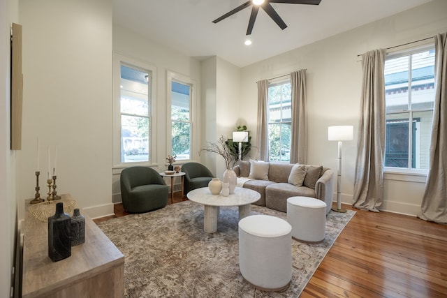 living room with hardwood / wood-style floors, plenty of natural light, and ceiling fan