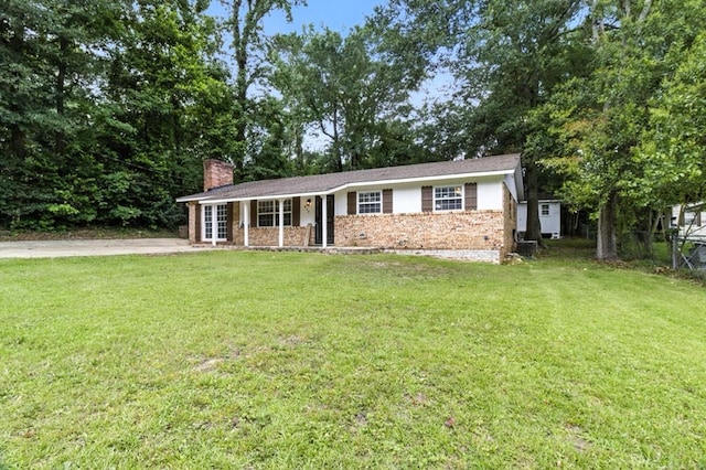 813 Wright Dr, Columbus, GA 31907 - ranch-style home with a chimney, brick siding, and french doors