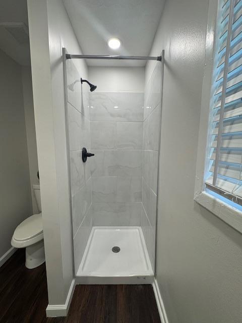 813 Wright Dr, Columbus, GA 31907 - bathroom with wood finished floors and tiled shower
