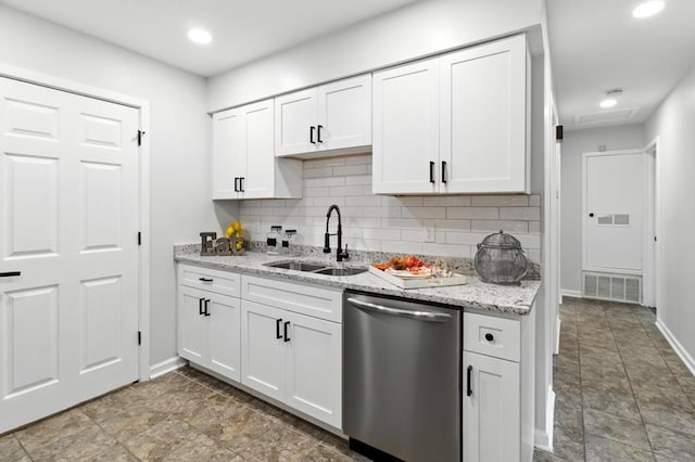 813 Wright Dr, Columbus, GA 31907 - kitchen with stainless steel dishwasher, decorative backsplash, white cabinetry, light stone counters, and recessed lighting