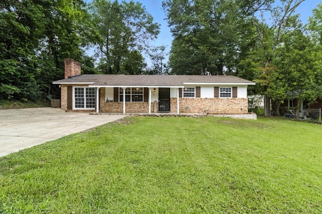 813 Wright Dr, Columbus, GA 31907 - ranch-style home featuring a chimney, a front yard, covered porch, and brick siding