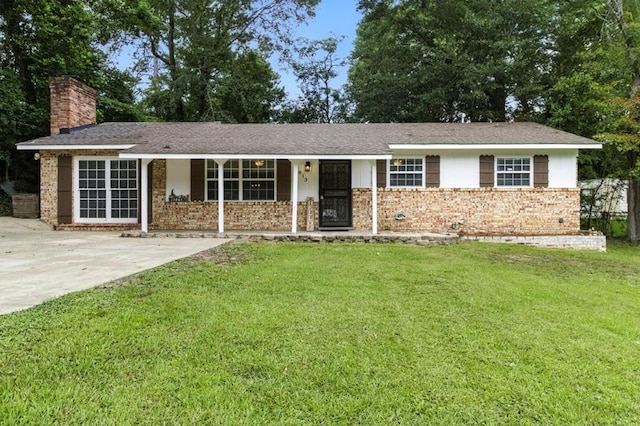 813 Wright Dr, Columbus, GA 31907 - single story home with a chimney, a front lawn, brick siding, and covered porch