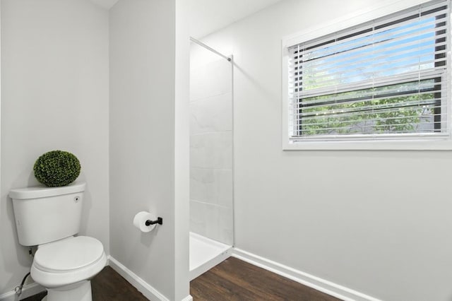 813 Wright Dr, Columbus, GA 31907 - bathroom featuring a tile shower and wood finished floors