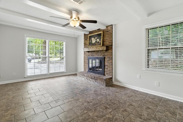 813 Wright Dr, Columbus, GA 31907 - unfurnished living room with beamed ceiling, ceiling fan, and a brick fireplace
