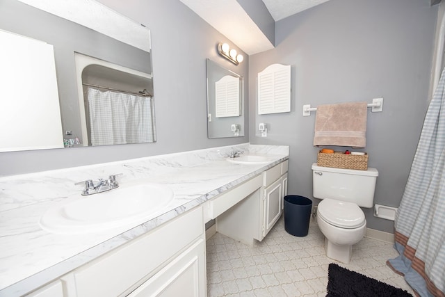 6909 Trapper Way, Midland, GA 31820 - bathroom featuring double vanity and toilet
