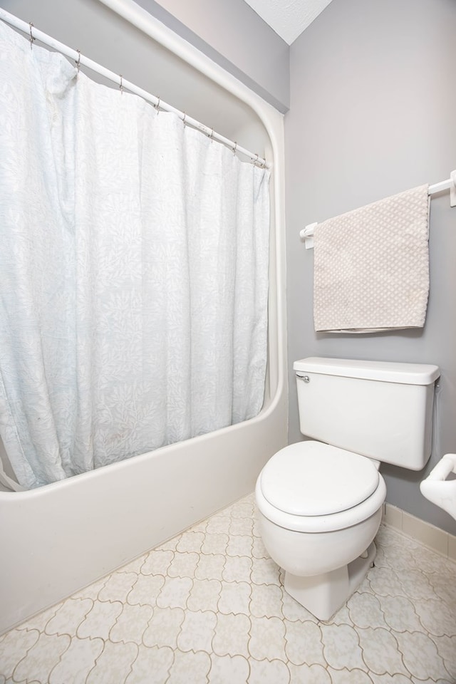 6909 Trapper Way, Midland, GA 31820 - bathroom featuring shower / bath combo with shower curtain and toilet