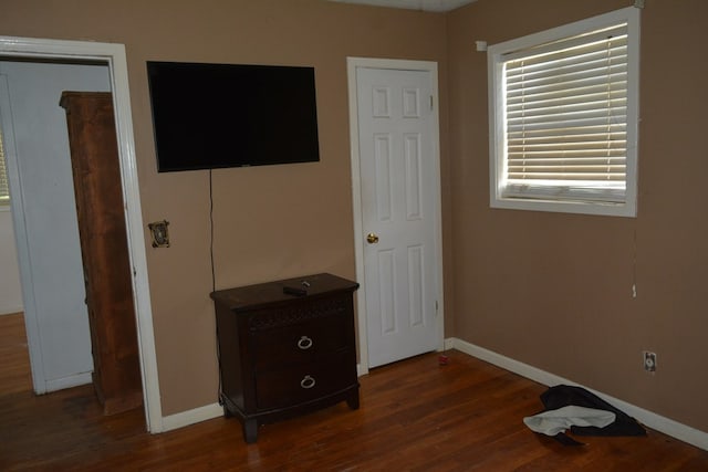 5137 Burbank St, Columbus, GA 31907 - unfurnished bedroom featuring baseboards and dark wood-type flooring