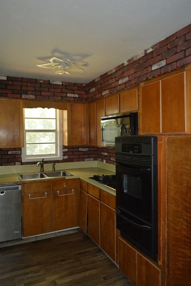 5137 Burbank St, Columbus, GA 31907 - kitchen with black appliances, a warming drawer, a ceiling fan, light countertops, and brown cabinets