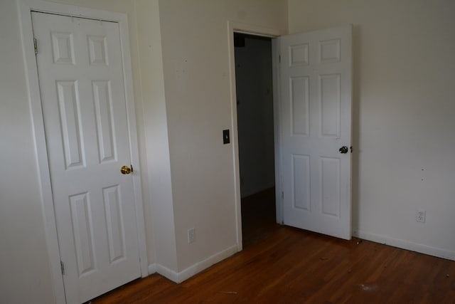 5137 Burbank St, Columbus, GA 31907 - unfurnished bedroom with baseboards and dark wood-style flooring