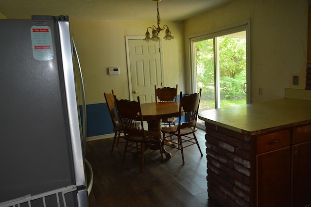 5137 Burbank St, Columbus, GA 31907 - dining room with a chandelier and dark wood-style flooring