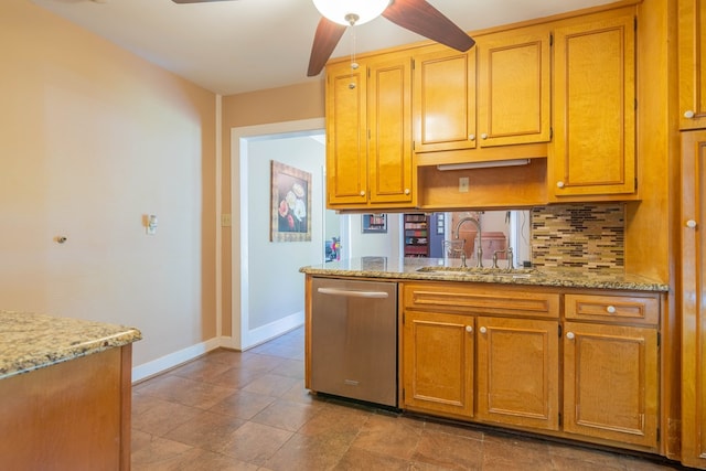 kitchen featuring a sink, a ceiling fan, baseboards, decorative backsplash, and dishwasher